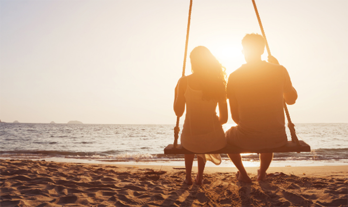oxytocin patient blog image of a couple on a swing at the beach
