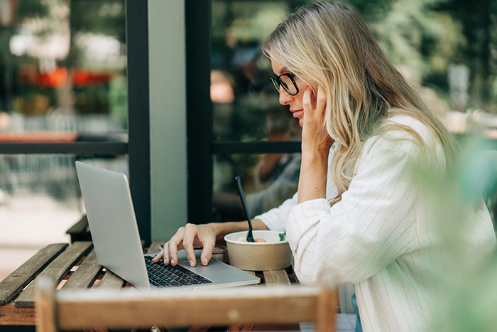 progesterone dosage for menopause medication image of a woman working on a laptop
