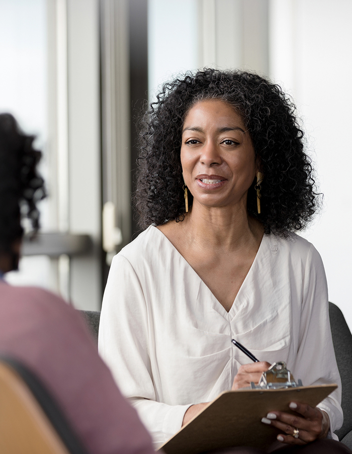 autism symptoms doctor talking to patient
