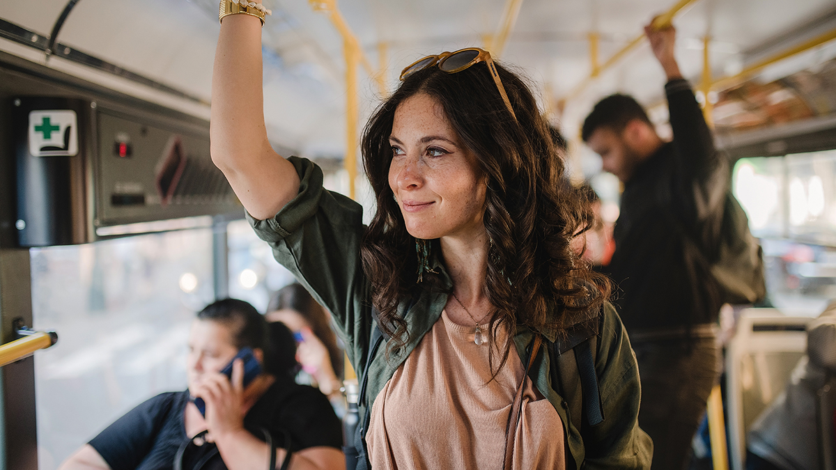 Adult Woman Commuting on a Bus on Belmar Pharma Solutions Homepage