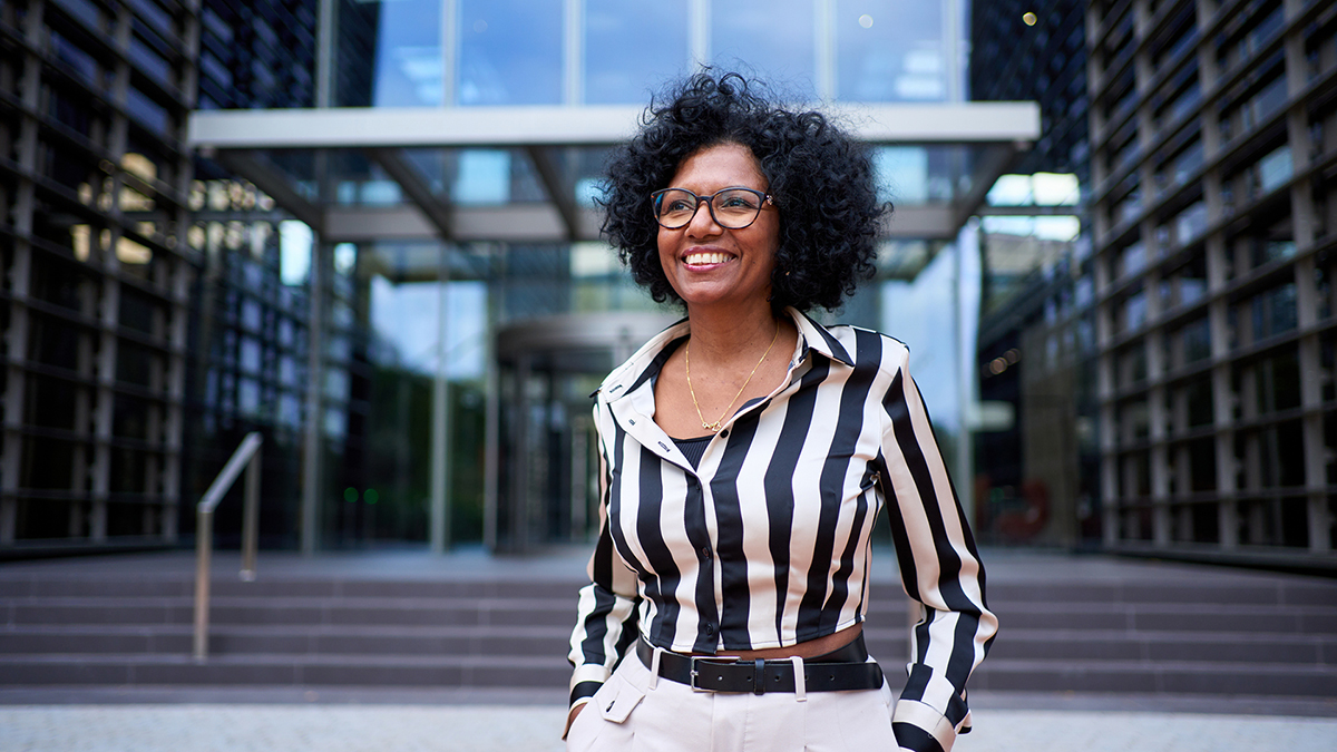 Happy Women Outside a Building on Belmar Pharma Solutions Homepage