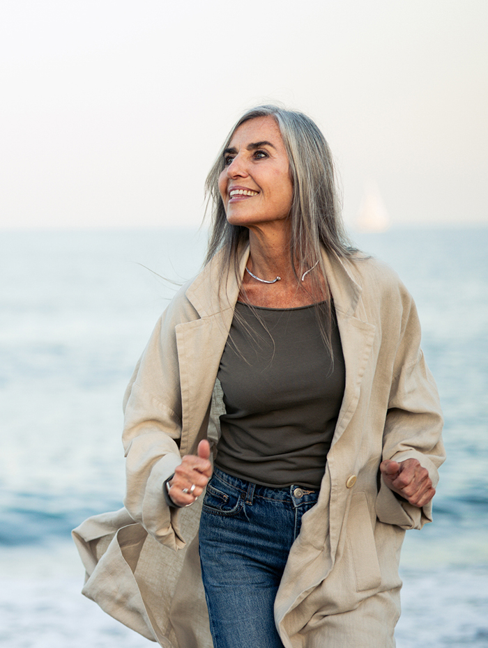 chelation therapy banner showing a woman with a beach in the background