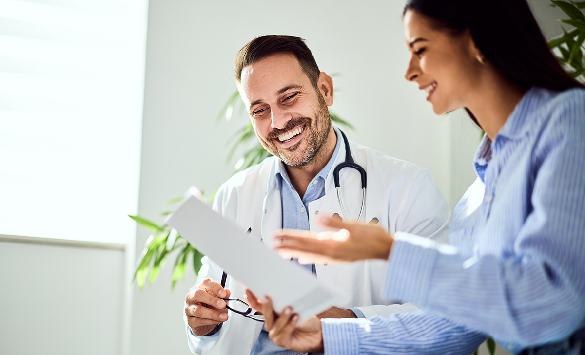 clinicians banner doctor and patient talking and smiling