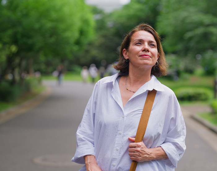hashimotos thyroiditis woman walking in park