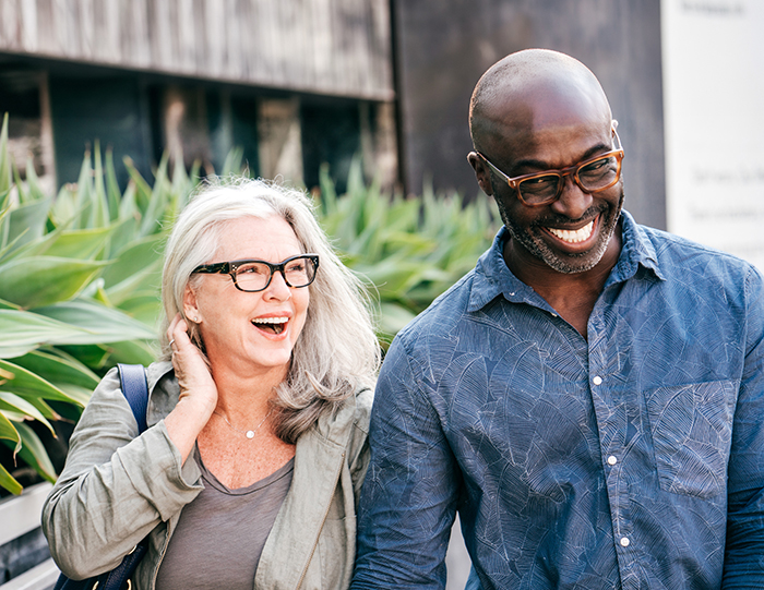 hormone pellets image with smiling woman and man