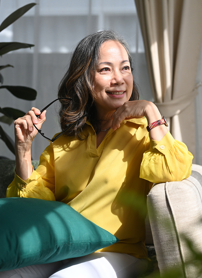 longevity woman on couch with glasses