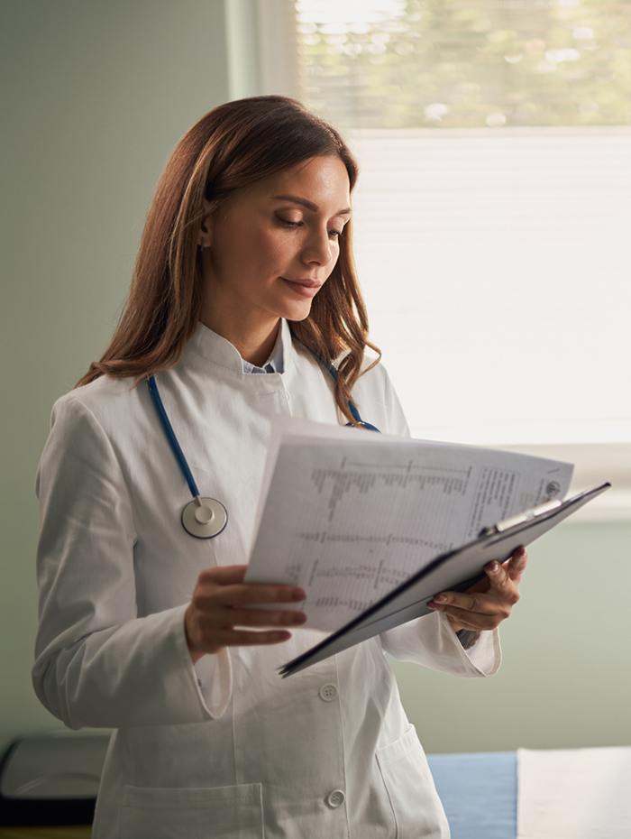 lupus symptoms doctor reading charts