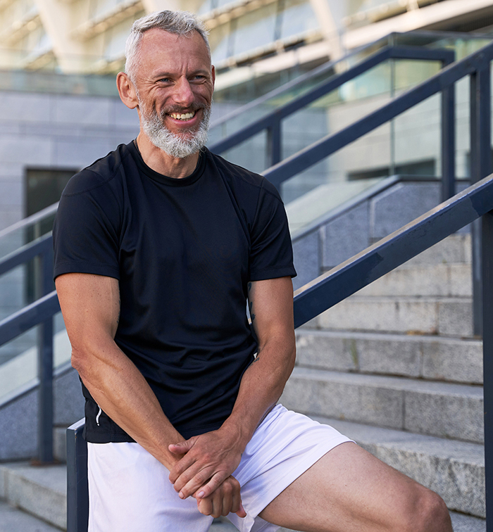 Middle Aged Man Showing Belmar Pharma Solutions Areas of Care for Men's Health