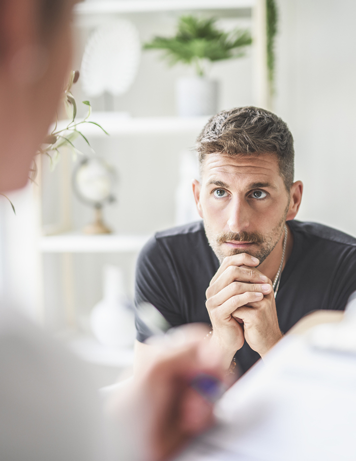 ptsd patient talking to doctor clipboard