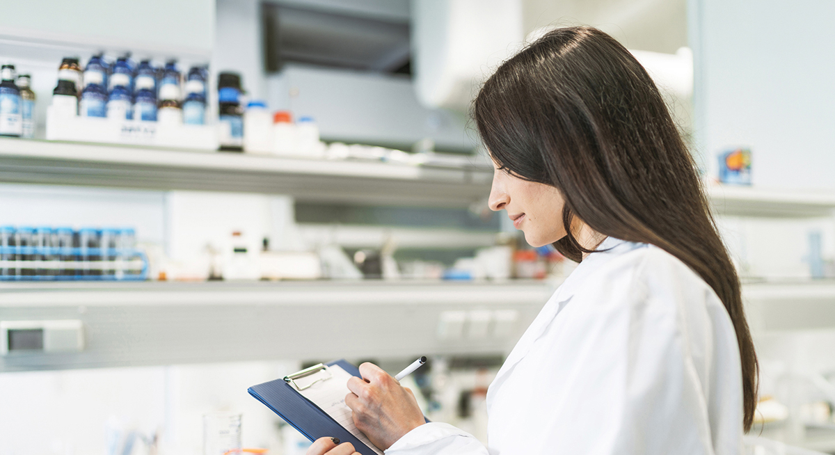 quality and compliance clinicians banner image of scientist writing on notepad