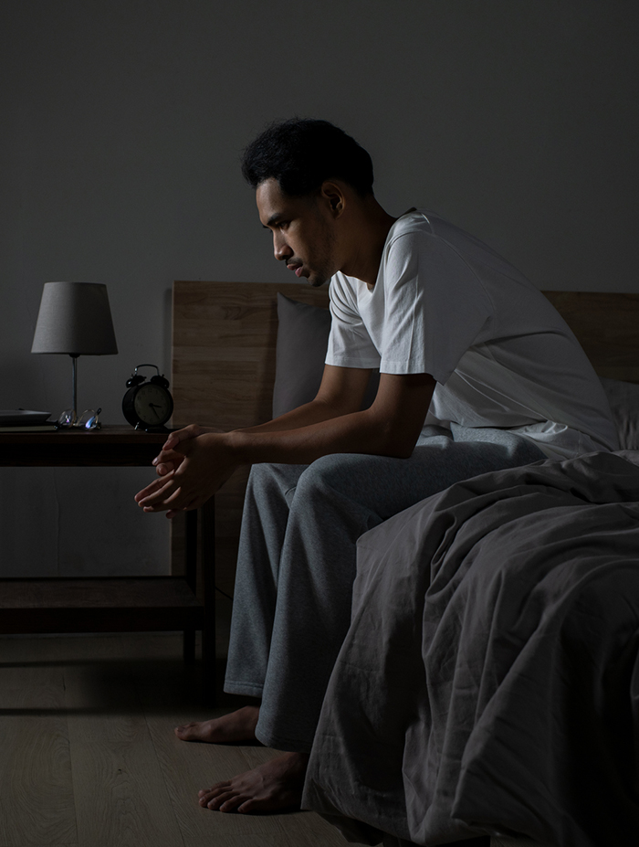 sleeping disorders man awake at night symptoms