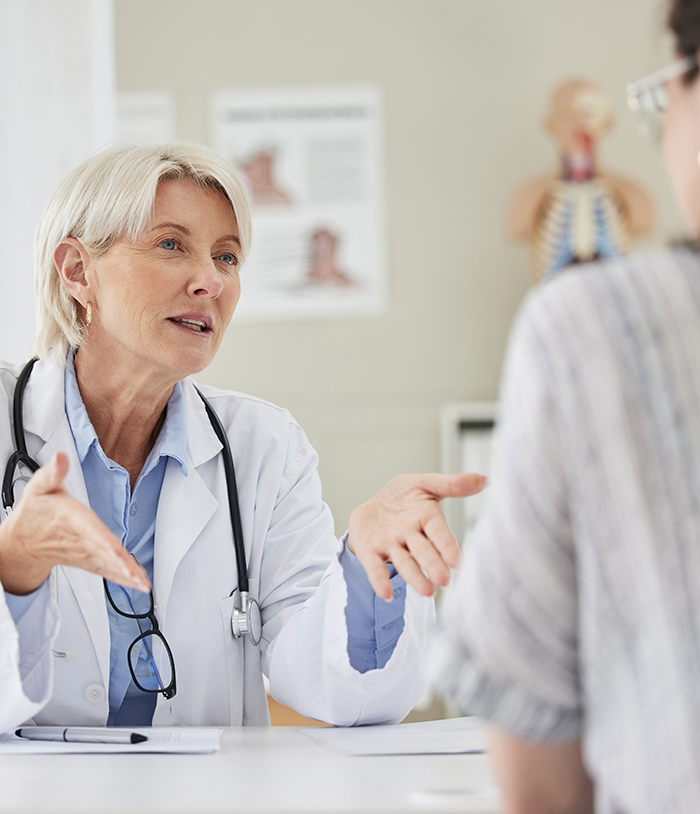 thyroid disorders symptoms doctor talking to patient