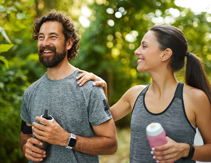 weight management image of man and woman walking