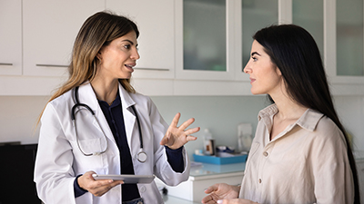 Pharmacist using a microscope. Learn when you should choose a Belmar pharmacist.