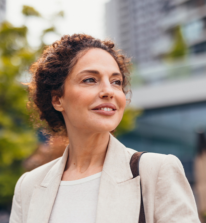 Confident Business Woman Showing Belmar Pharma Solutions Areas of Care for Women's Health